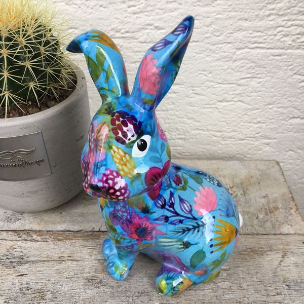 Image sur Joyeux lapin de Pâques en céramique en bleu avec des fleurs 
