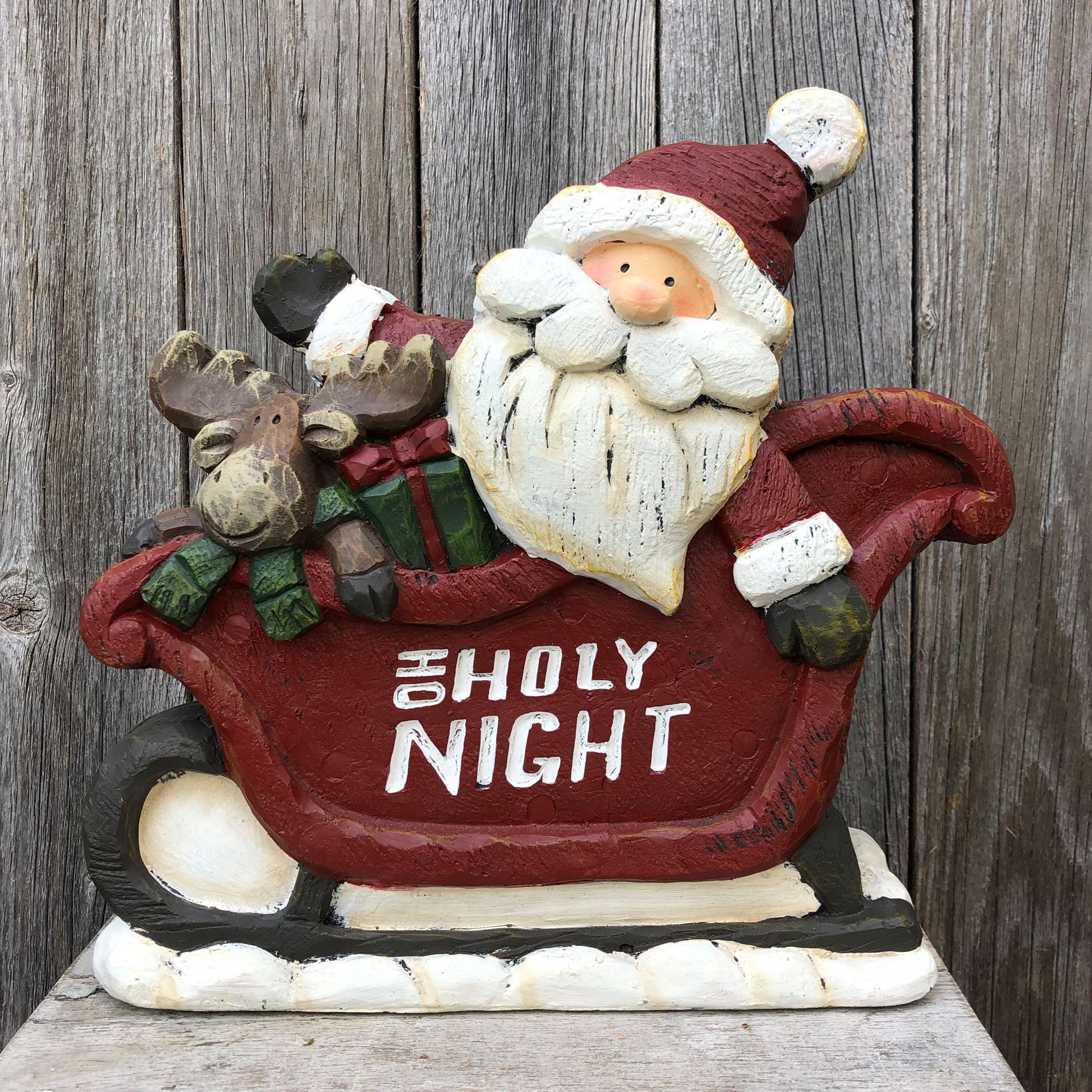 Joyeux Père Noël avec son traîneau au style vintage